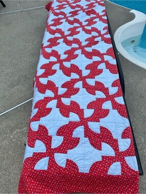 Hand crafted 60”x80” Red and light blue Drunkards Path Quilt
